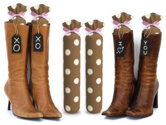 One Pair of 15-inch-tall fabric boot inserts covered in brown fabric with white polka dots and with black wooden tags reading "I Love You.” tied around the top of the insert. Any message can be written on the black wooden tags. And two pairs of boots with the boot tree inserts inside them keeping them upright.