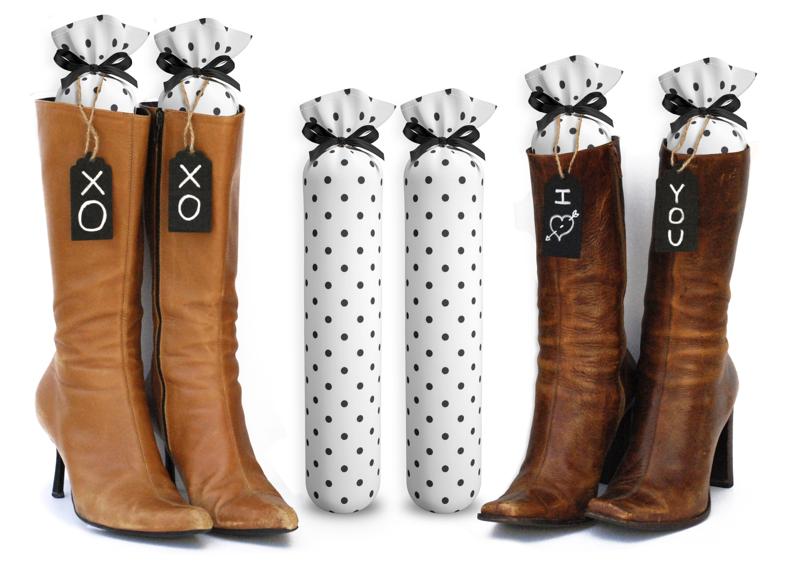 One Pair of 15-inch-tall fabric boot inserts covered in white fabric with black polka dots and with black wooden tags reading "I Love You.” tied around the top of the insert. Any message can be written on the black wooden tags. And two pairs of boots with the boot tree inserts inside them keeping them upright.