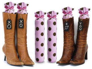 One Pair of 15-inch-tall fabric boot inserts covered in pink fabric with brown polka dots and with black wooden tags reading "I Love You.” tied around the top of the insert. Any message can be written on the black wooden tags. And two pairs of boots with the boot tree inserts inside them keeping them upright.