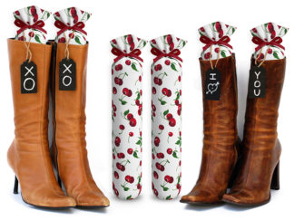 One Pair of 15-inch-tall fabric boot inserts covered in white fabric with red cherries and with black wooden tags reading "I Love You.” tied around the top of the insert. Any message can be written on the black wooden tags. And two pairs of boots with the boot tree inserts inside them keeping them upright.
